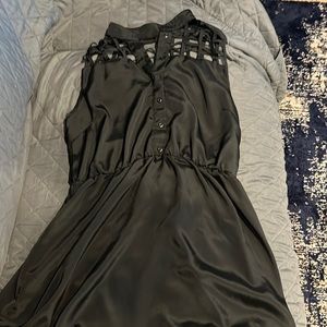 Women’s Forever 22 dress black silky size L with open design on the front.